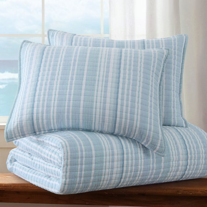 Boracay Stripe Muslin Quilt Set featuring soft textured cotton, striped pattern in aqua and seafoam, with standard shams.