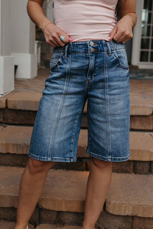 THE OLIVE SLOUCHY BERMUDA SHORTS IN MEDIUM WASH