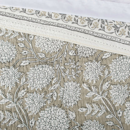 Floral patterned fabric with white flowers on a beige background