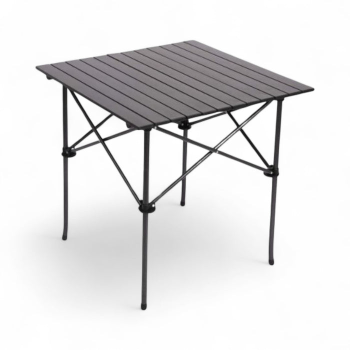 Portable folding table with metal top and black legs on a white background