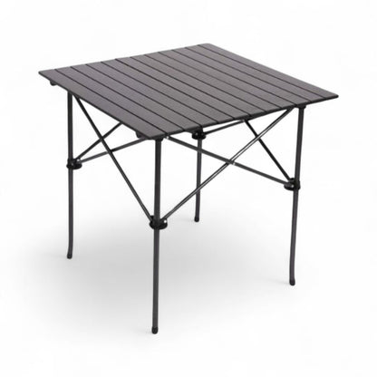 Portable folding table with metal top and black legs on a white background