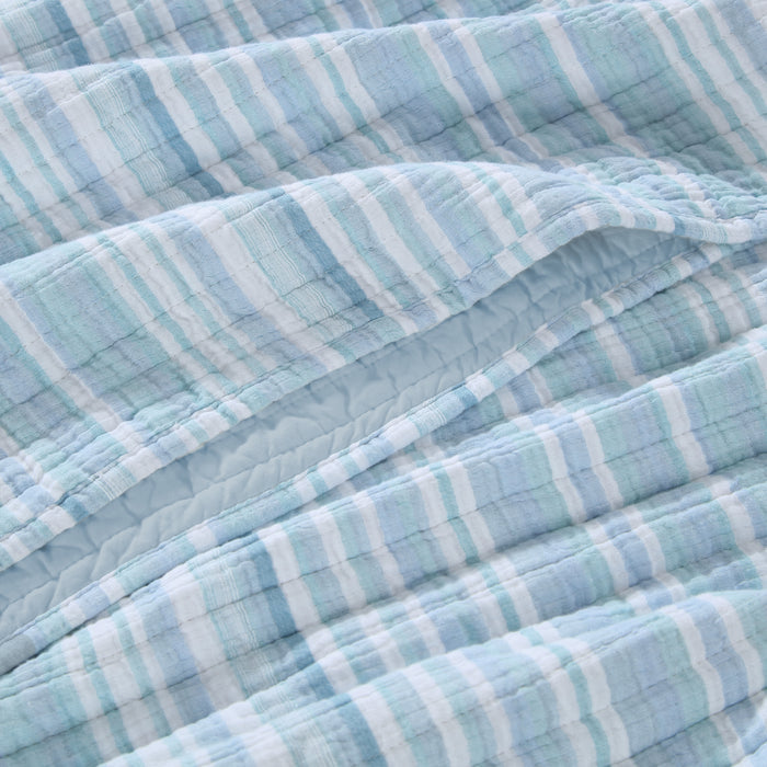 Boracay Stripe Muslin Quilt Set featuring a soft, textured cotton layout in soothing aqua and seafoam stripes.