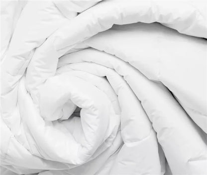 Soft white quilted comforter for cozy bedroom bedding, perfect for mattresses and bed frames