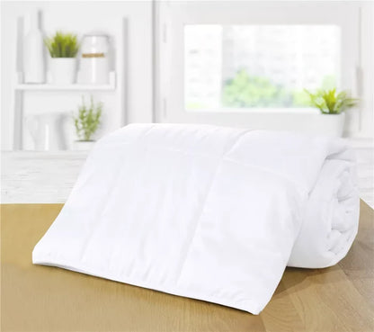 White quilted mattress protector on wooden surface, ideal for bed frames and mattresses
