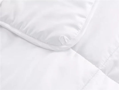 White quilted mattress protector with corner tie, ideal for bed frames and mattresses