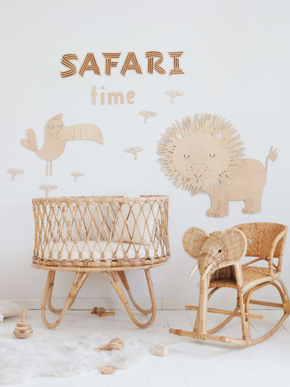 Safari lion and bird wooden wall art with safari time text in playroom with crib