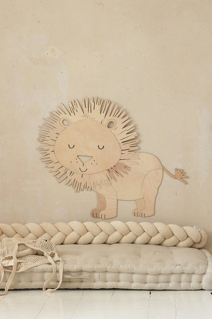 Close-up of wooden lion wall art showing detailed mane and gentle facial features