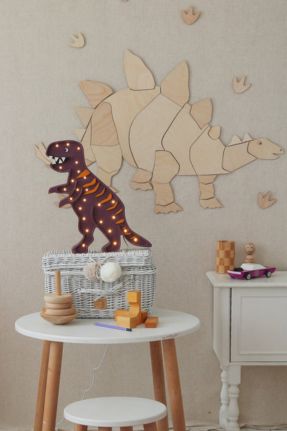 Wooden stegosaurus wall decoration with LED-lit brown dinosaur figurine and toys