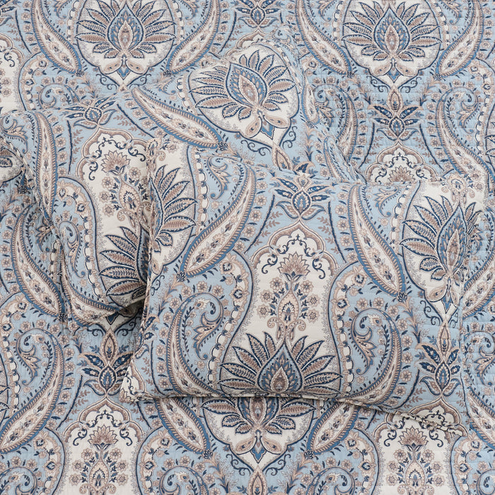 Patterned fabric with intricate design in blue and beige tones