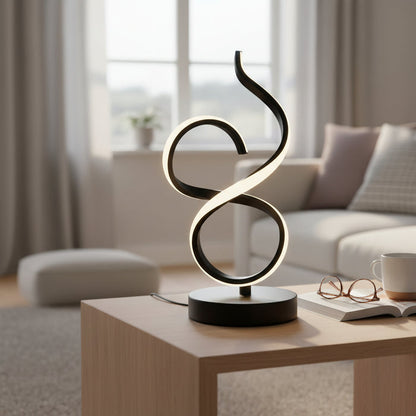 Modern LED table lamp with artistic loop design on wooden coffee table in cozy living room.