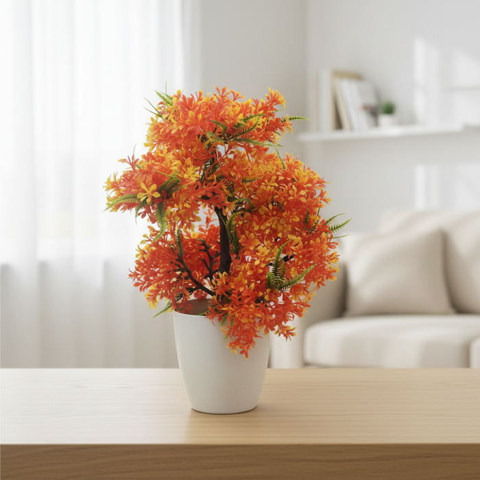 Vibrant orange artificial flower arrangement in white pot on wooden table, perfect for home decor