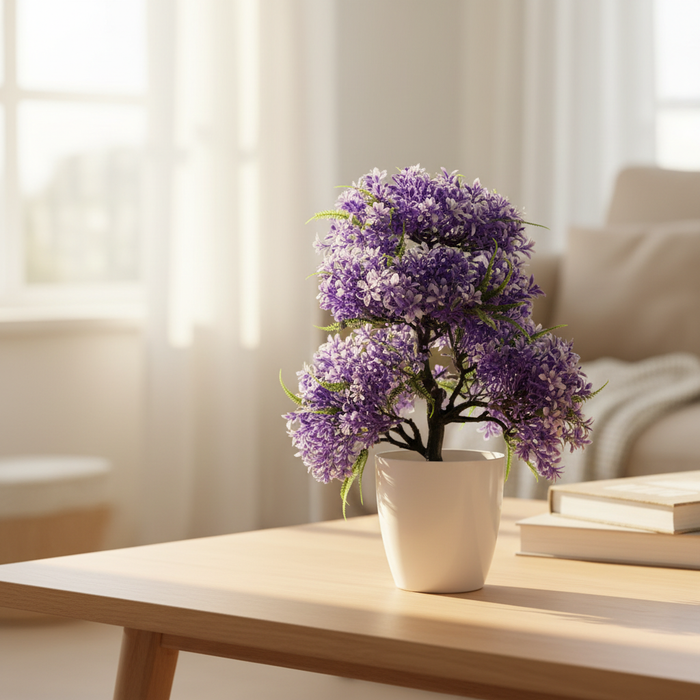Purple artificial flower arrangement in white pot on wooden table, home decor accent