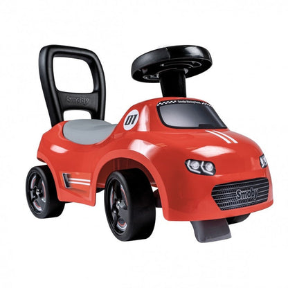 Red Smoby ride-on car with black handle and steering wheel, front angle view
