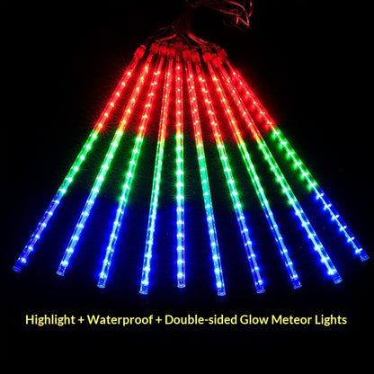 LED meteor shower lights in red, green, and blue glowing on a black background
