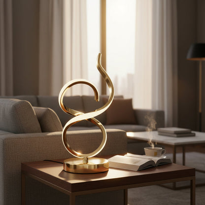 Modern gold sculptural lamp on wood coffee table in stylish living room with sofa and books